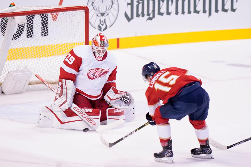 Florida Panthers center Anton Lundell (15) attempts a shot at Detroit Red Wings goaltender Thomas Greiss (29) during the first period Saturday, March 5, 2022, in Sunrise, Fla.