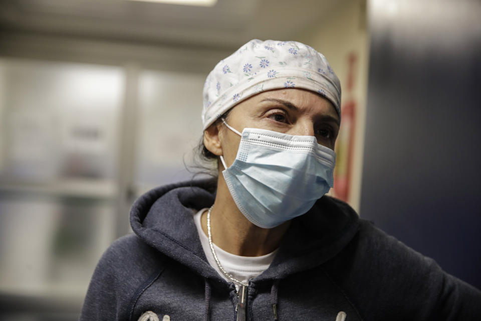 Nurse Cristina Settembrese talks during an interview with the Associated Press outside the intensive care unit after finishing a night shift, at the San Paolo hospital, in Milan, Italy, Thursday, Oct. 15, 2020. (AP Photo/Luca Bruno)