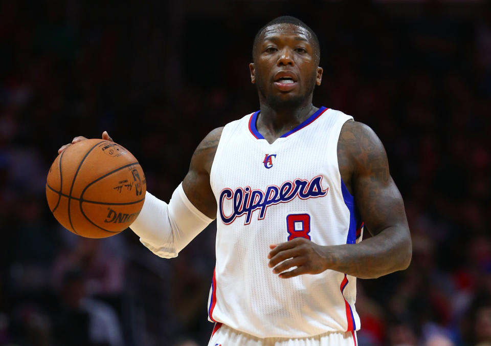 LOS ANGELES, CA - MARCH 17:  Nate Robinson #8 of the Los Angeles Clippers dribbles the ball against the Charlotte Hornets in the second half during the NBA game at Staples Center on March 17, 2015 in Los Angeles, California. The Clippers defeated the Hornets 99-92. NOTE TO USER: User expressly acknowledges and agrees that, by downloading and/or using this photograph, user is consenting to the terms and conditions of the Getty Images License Agreement.  (Photo by Victor Decolongon/Getty Images)