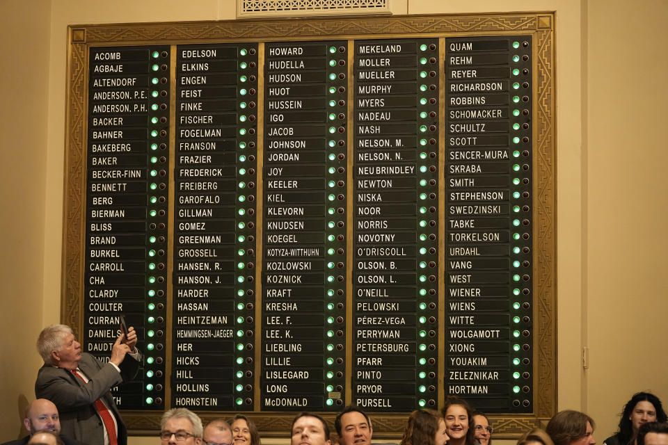 The names of Minnesota House Members are lit up after taking attendance during the first day of the 2023 Legislative session, Tuesday, Jan. 3, 2023, in St. Paul, Minn. (AP Photo/Abbie Parr)