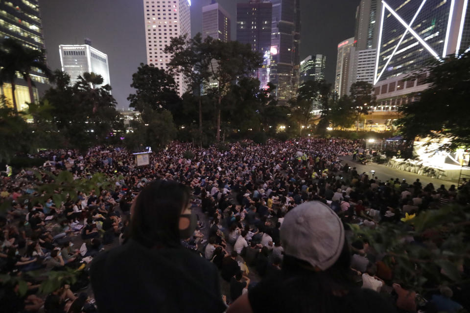 CORRECTS DATE Protesters gather during a rally in Hong Kong on Saturday, Oct. 26, 2019. Hong Kong authorities have won a temporary court order banning anyone from posting personal details or photos of police officers online, in their latest effort to clamp down on the city's protest movement. (AP Photo/Mark Schiefelbein)