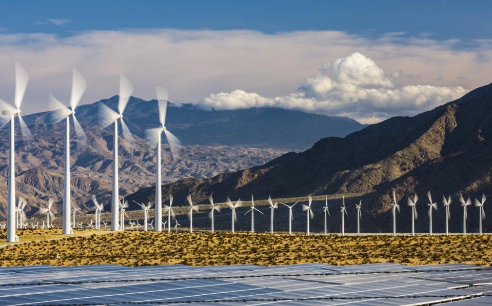 <span class="caption">Wind turbines and solar panels in Southern California.</span> <span class="attribution"><a class="link " href="https://www.gettyimages.com/detail/photo/wind-turbines-and-solar-panels-royalty-free-image/1133686786?adppopup=true" rel="nofollow noopener" target="_blank" data-ylk="slk:4kodiak/E+ via Getty Images">4kodiak/E+ via Getty Images</a></span>