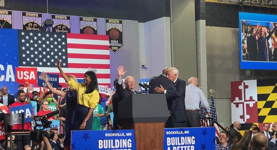 In this file photo, Maryland's senior U.S. Sen. Ben Cardin, a Democrat, center, waves after a rally in Rockville on August 25, 2022.