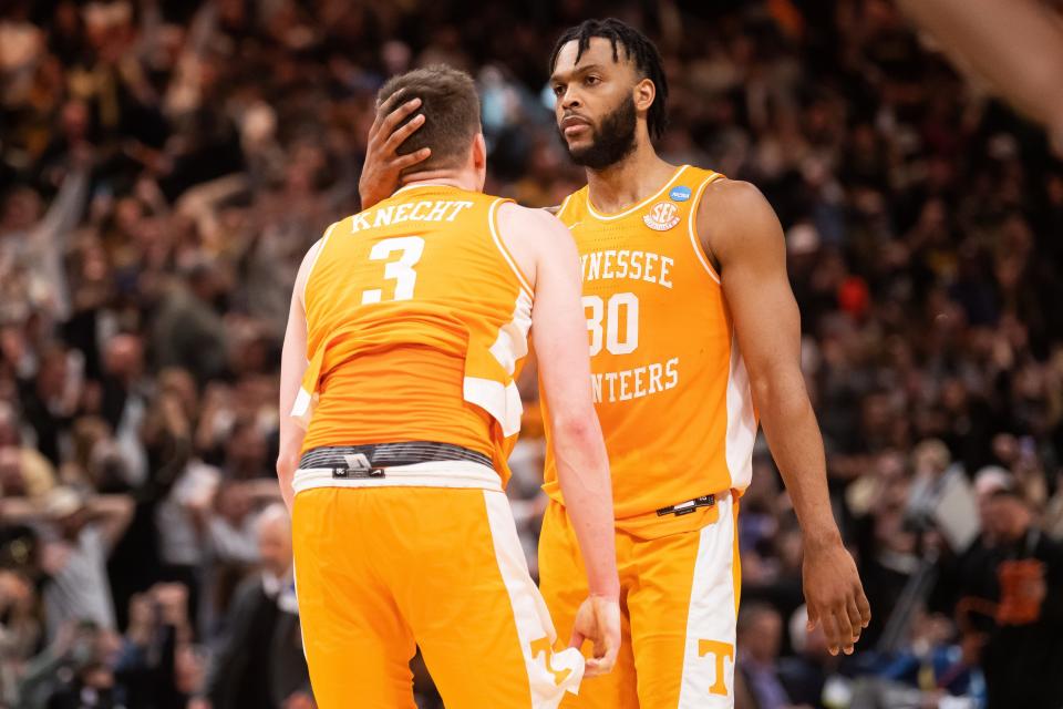 Josiah-Jordan James (30) consoles Dalton Knecht (3) after Tennessee's Elite Eight loss to Purdue at Little Caesars Arena in Detroit on March 31.