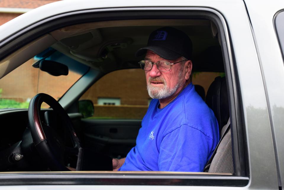 Croswell resident Larry Hall sits in his GMC pickup truck in a line behind multiple cars at the Marathon gas station on Main Street in Lexington on Monday, June 6, 2022. Hall arrived at 7 a.m. to be one of the first people in line as he planned to put 15 gallons in his pickup truck and fill two five-gallon gas cans for his lawnmower. Hall was also considering canceling his camping vacation up north due to the price of gas, as he normally pulls a camper using a diesel-powered pickup truck.