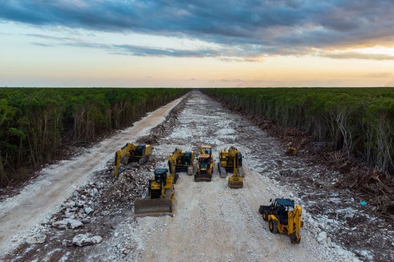 Excavators work on a deforested stretch of the Tren Maya railway line in the middle of the Mexican rainforest. Fernando Martinez Belmar/FMB/dpa