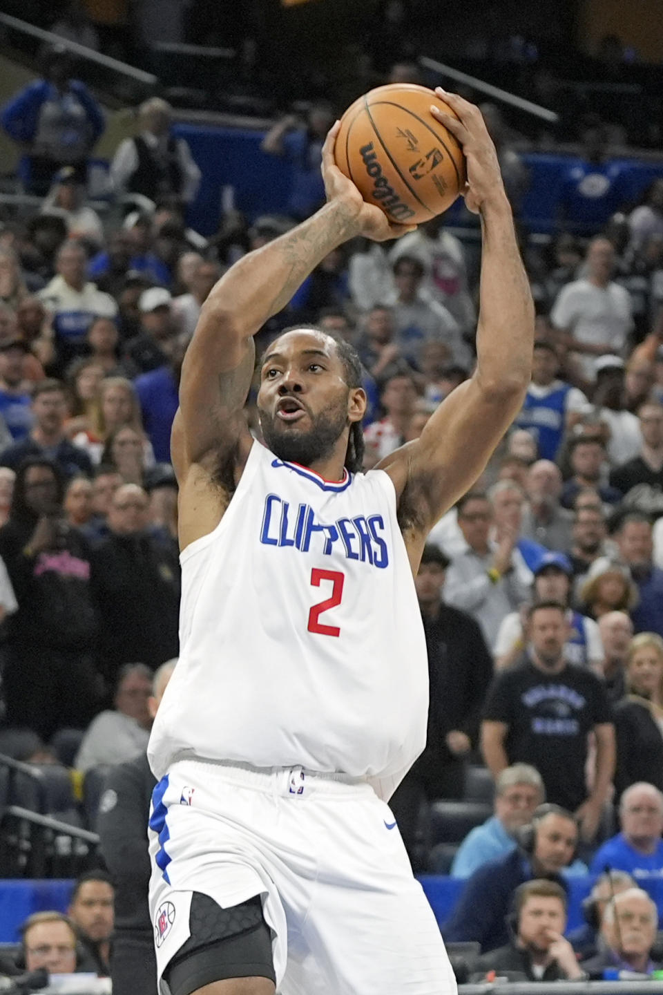 FILE - Los Angeles Clippers forward Kawhi Leonard (2) shoots against the Orlando Magic during the second half of an NBA basketball game, Friday, March 29, 2024, in Orlando, Fla. “Kawhi has been ramping up for the Olympics over the past several weeks and had a few strong practices in Las Vegas,” USA Basketball said in a statement Wednesday, July 10, 2024. “He felt ready to compete. However, he respects that USA Basketball and the Clippers determined it's in his best interest to spend the remainder of the summer preparing for the upcoming season rather than participating in the Olympic Games in Paris.””(AP Photo/John Raoux, File)