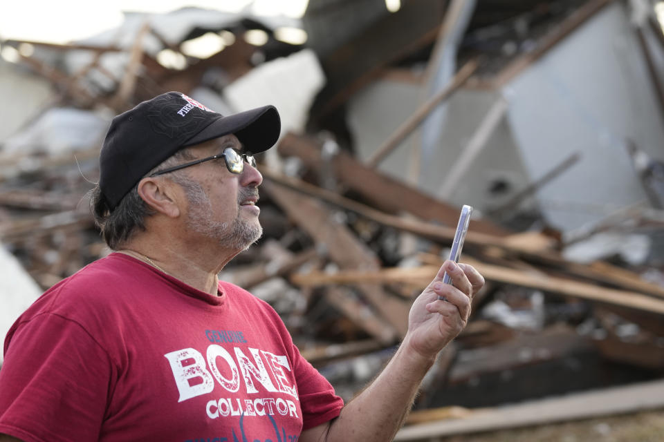 John Liparito surveys storm damage Tuesday, Jan. 24, 2023, in Pasadena, Texas. A powerful storm system took aim at Gulf Coast Tuesday, spawning tornados that caused damage east of Houston. (AP Photo/David J. Phillip)