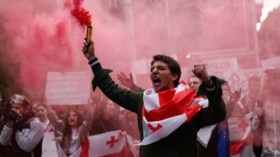 Georgian students protest in Tbilisi on May 13 against the bill which would require NGOs and media organizations who receive more than 20% of their funding from abroad to register as "agents of foreign influence." - Giorgi Arjevanidze/AFP/Getty Images