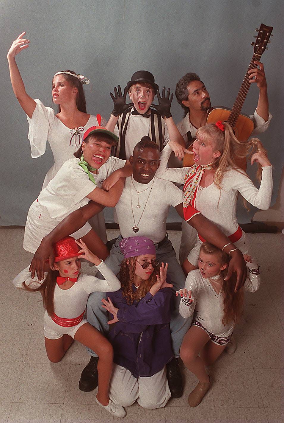 Joolie Davis, Jane Wall, George Brittain, Erica Pringle, Thym Kennedy, Corie Hammonds, Jessica Bongiorno, Jessica Taube and April Ingraham pose during a production in the 1990s.