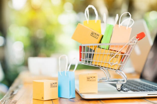 Product package boxes and shopping bag in cart with laptop computer which web store shop on screen for online shopping and delivery concept - Credit: Mymemo - stock.adobe.com