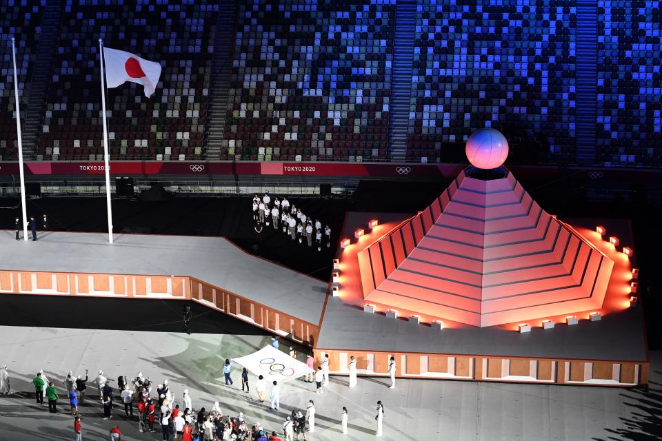 <p>An overview shows the Olympic flag being carried onto the field of play during the opening ceremony of the Tokyo 2020 Olympic Games, at the Olympic Stadium, in Tokyo, on July 23, 2021. (Photo by François-Xavier MARIT / AFP) (Photo by FRANCOIS-XAVIER MARIT/AFP via Getty Images)</p> 