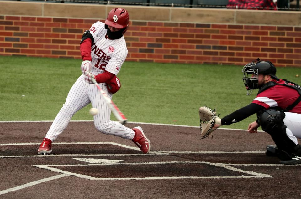 Bryce Madron drives in a game-tying run for the Sooners against Rider on Feb. 24 at Rider at L. Dale Mitchell Park in Norman.