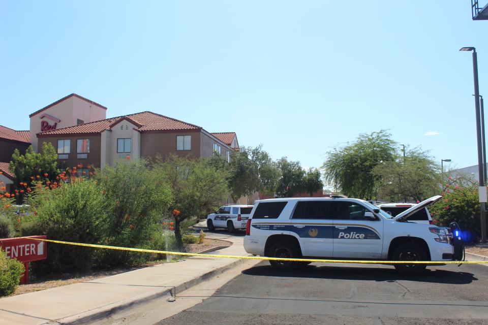 Phoenix Police Department vehicles and caution tape block off the entrance to Red Roof Inn off Interstate 17 and Bell Road on July 15, 2022, after a police shooting.
