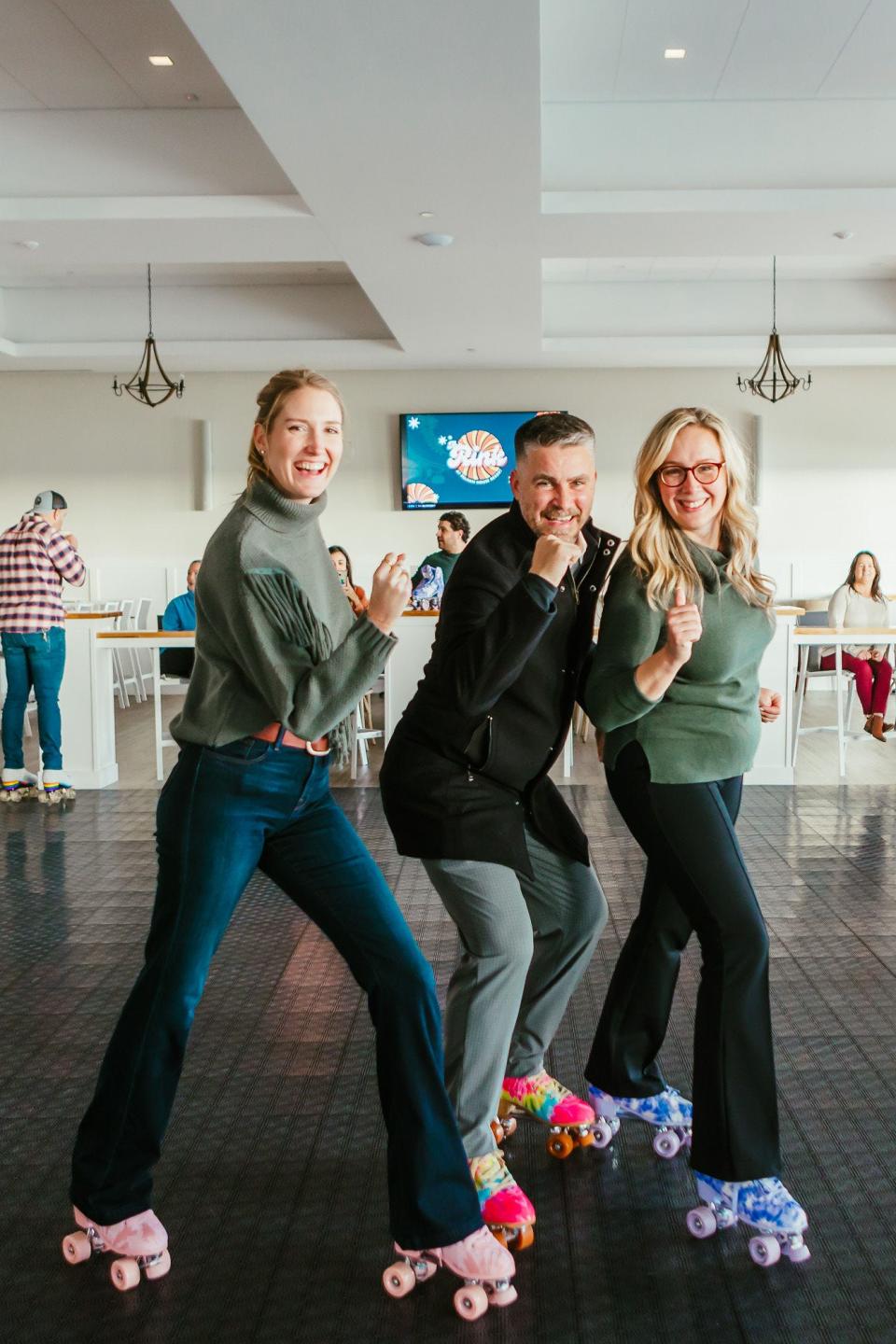 Tara Concannon (left), Pelham House Resort managing partner John McCarthy and Heather McCarthy get their balance trying out the new roller skating rink at the Dennis Port resort. The rink will operate weekends through the end of March.