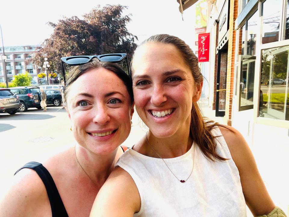 simone and her cousin posing for a selfie on the streets of victoria canada