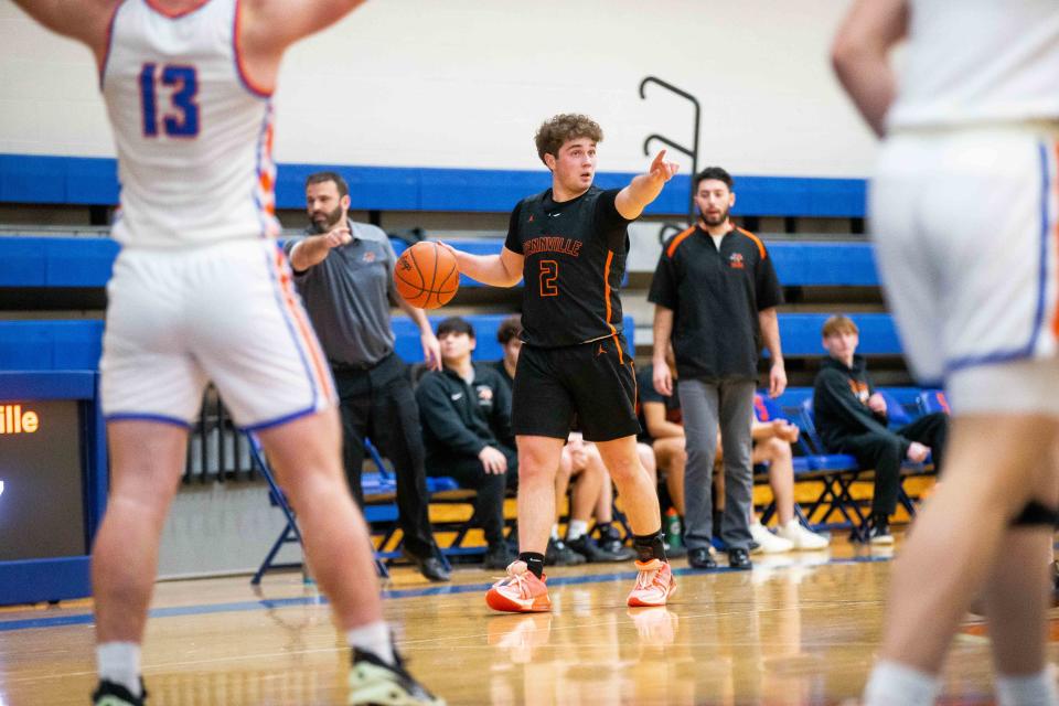 Fennville's Ben Peterson calls a play as he takes the ball down the court Monday, Feb. 6, 2023, at Saugatuck High School. 