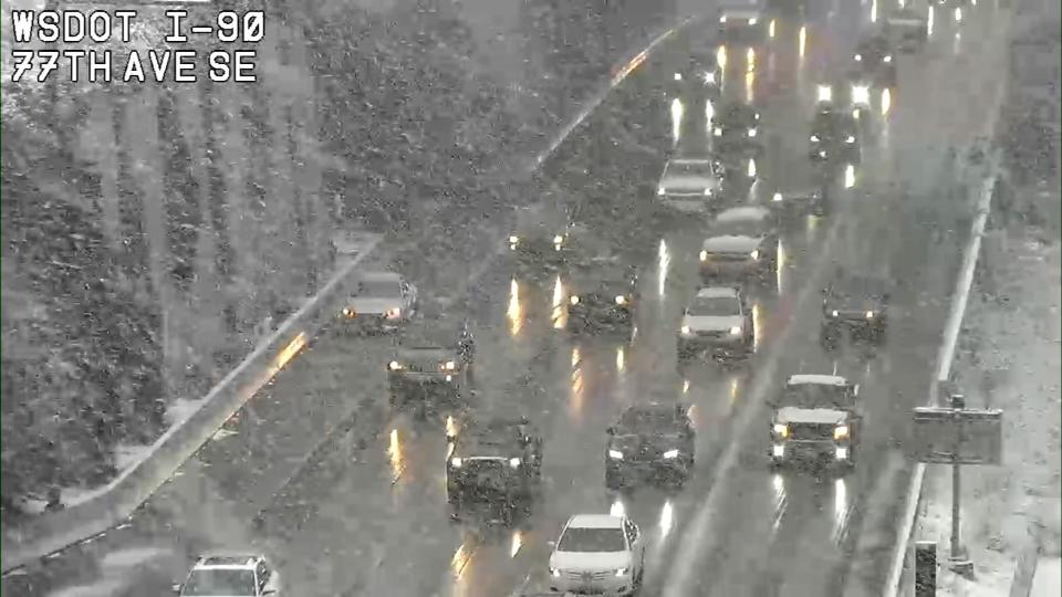 Washington State Department of Transportation cameras showed snow falling around Western Washington Wednesday.