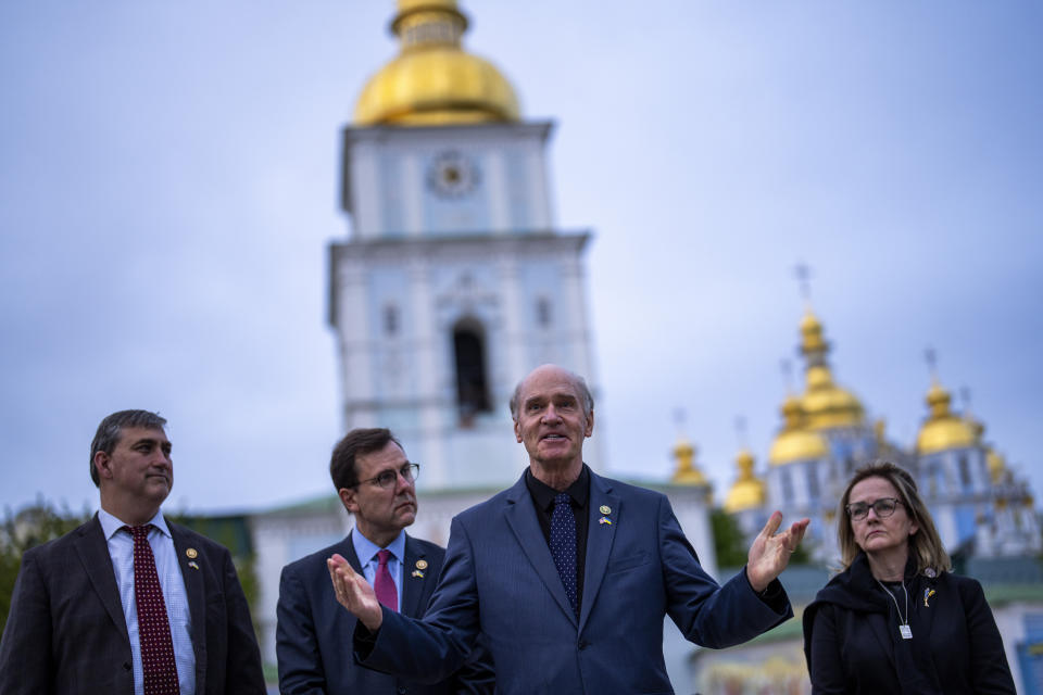 From left, U.S. representatives Nathaniel Moran, R-Tx, Tom Kean Jr, R-NJ, Bill Keating, D-Mass, and Madeleine Deane, D-Pa, speak to journalists during a joint news conference outside Saint Michael cathedral in Kyiv, Ukraine, Monday, April 22, 2024. A bipartisan delegation of U.S. Congress members met President Volodymyr Zelenskyy in Kyiv on Monday and praised the historic House vote to approve $61 billion in military aid for Ukraine. (AP Photo/Francisco Seco)