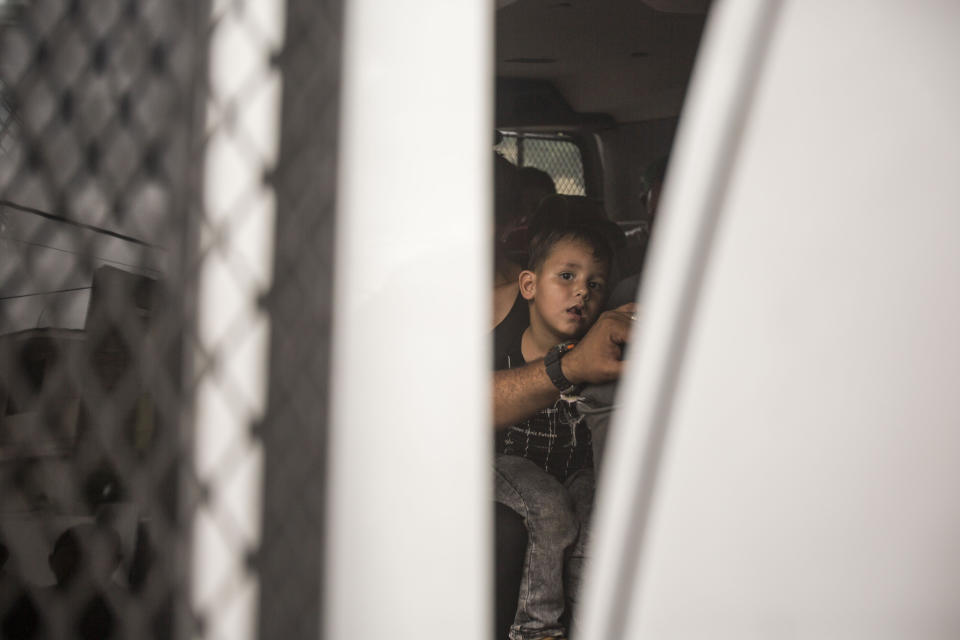 A youth without legal permission to be in Mexico sits inside an immigration van outside an office of the Attorney General as he and other migrants wait to be transported to Tapachula from Arriaga, Mexico, Sunday, June 23, 2019. Mexico has completed its deployment of 6,000 National Guard agents to help control the flow of migrants headed toward the U.S. and filled immigration agency posts to regulate border crossings, the government said Friday. (AP Photo/Oliver de Ros)wld