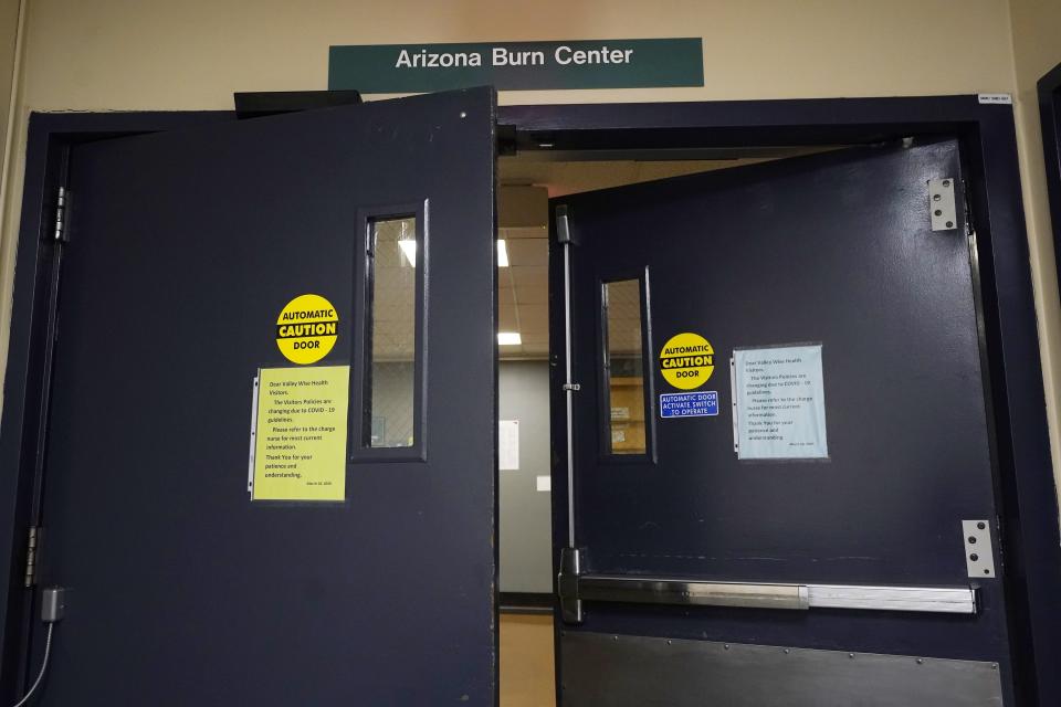 Arizona Burn Center Valleywise Health entrance shown Monday, June 14, 2021, in Phoenix. Emergency rooms like the one at the Arizona Burn Center in Phoenix, where director Dr. Kevin Foster said 104 people were admitted in June, July and August 2020 with serious burn injuries due to contact with hot surfaces. (AP Photo/Ross D. Franklin)