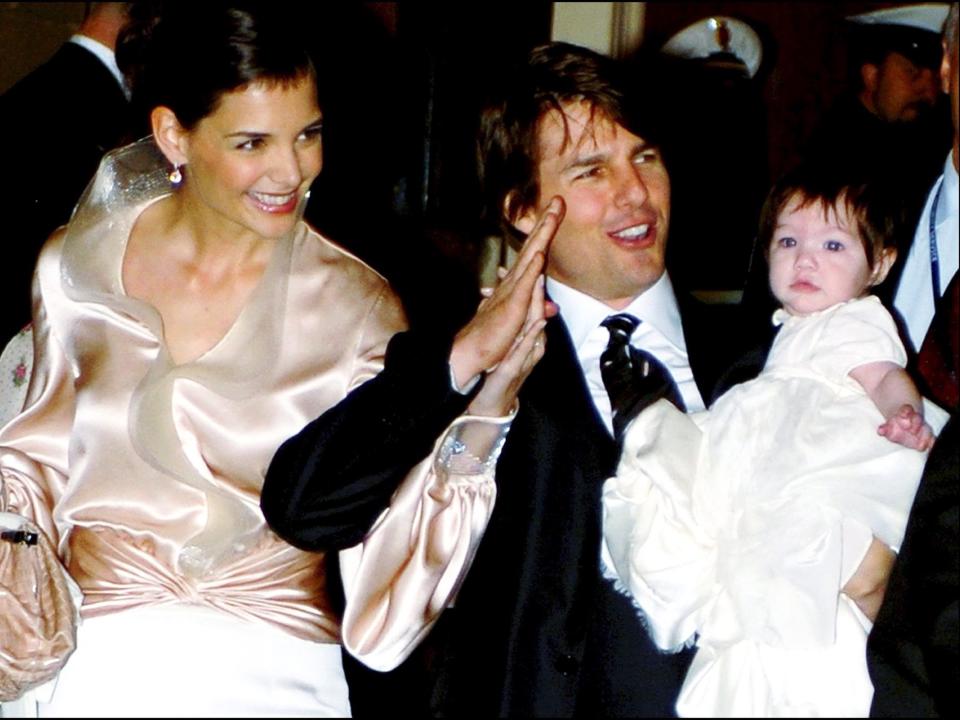 From left, Katie Holmes, Tom Cruise, and Suri Cruise in 2006.