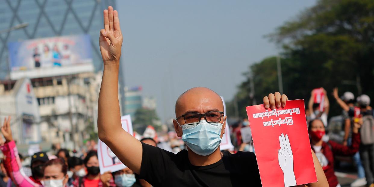 A Myanmar protester makes the three finger salute during a demonstration against military coup in Yangon, Myanmar on February 7, 2021. (Photo by Myat Thu Kyaw/NurPhoto via Getty Images)