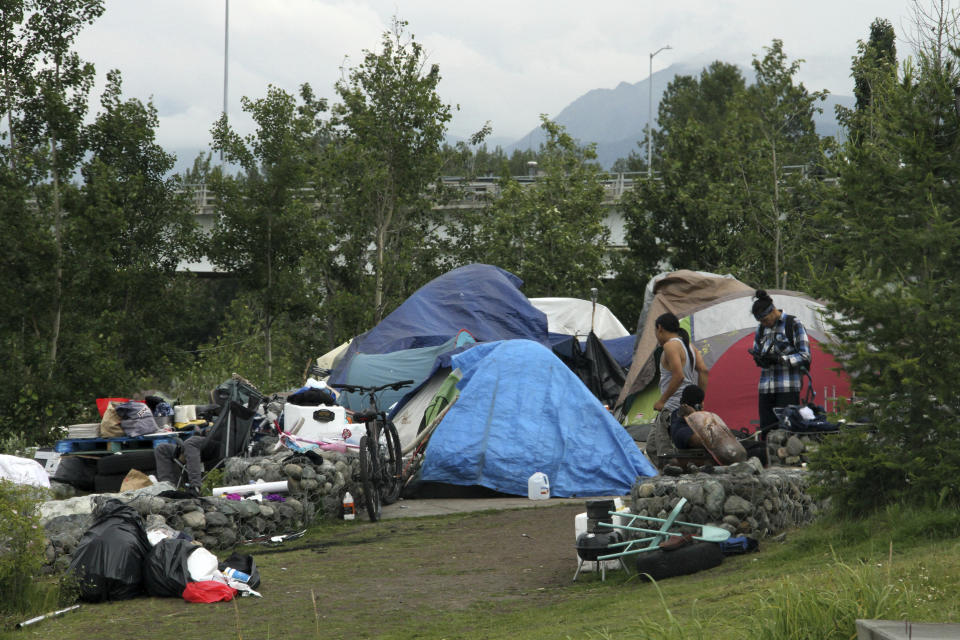 An outdoor tent city for the homeless is seen July 26, 2023, across from the city's historic railroad depot in downtown Anchorage, Alaska. Officials in Alaska's largest city are scrambling to find enough shelter for homeless people before the first snowfall usually in October, after the city's mass shelter held in at the "Sullivan Arena"was closed. (AP Photo/Mark Thiessen, File)