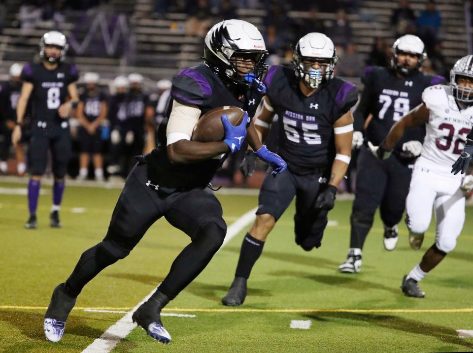 Mission Oak's Kenny Jackson on a long run against Mt. Whitney during their Central Section Division III high school quarterfinal football game in Tulare, Calif, Thursday, Nov. 9, 2023.