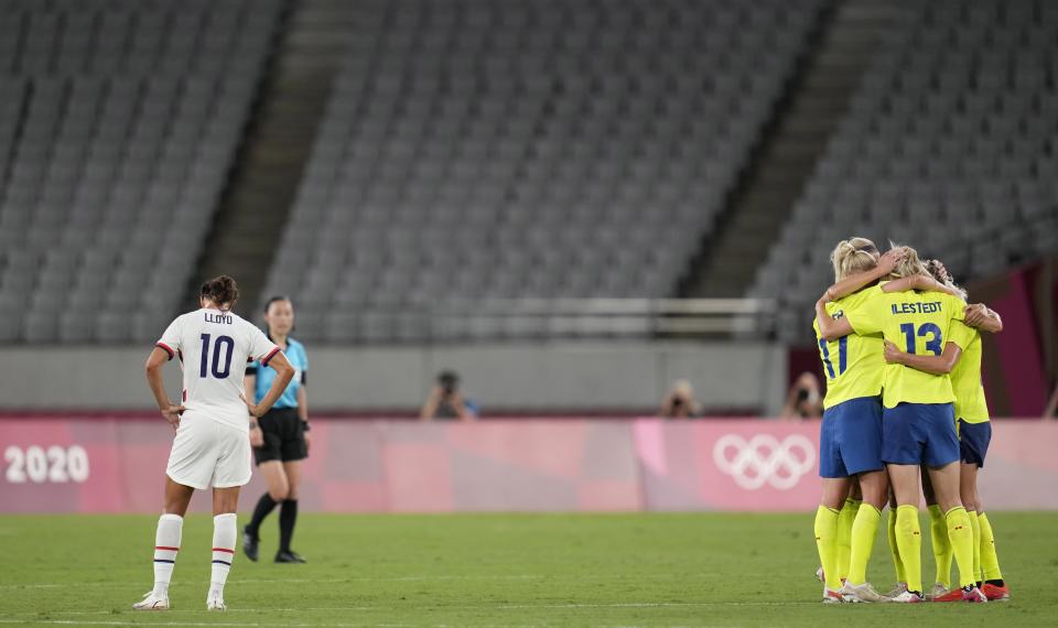 Sweden's players celebrate after beating 3-0 United States during a women's soccer match at the 2020 Summer Olympics, Wednesday, July 21, 2021, in Tokyo. (AP Photo/Ricardo Mazalan)