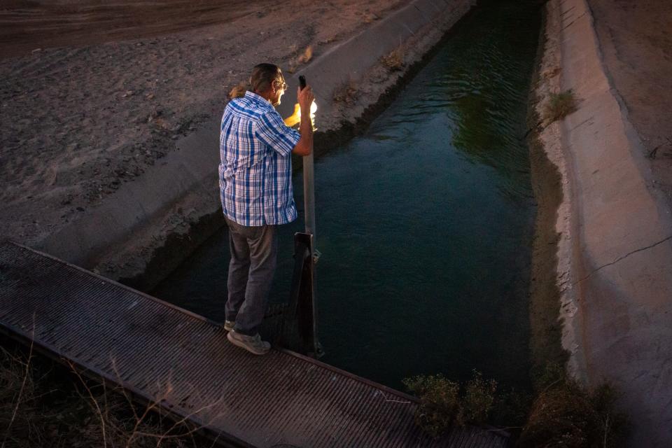 Water master Richard Becker (37 years) checks the flow meter on his morning rounds for the Cibola Valley Irrigation &amp; Drainage District, August 5, 2021, near Cibola, Arizona. The district was pumping 3.5 acre-feet per hour from the Colorado River to irrigate cotton.