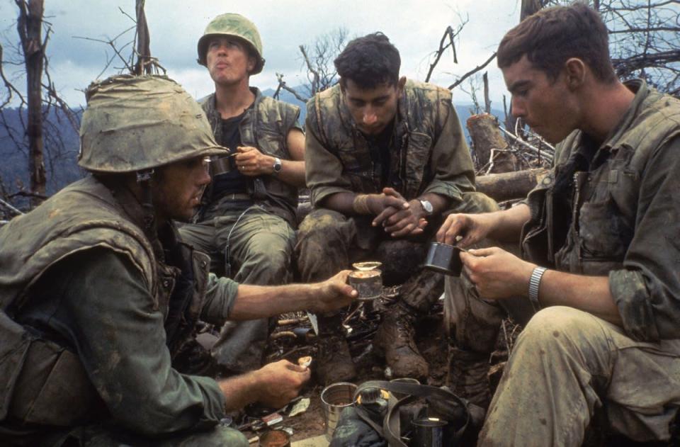 Image not published in original story in LIFE. American Marines eat rations during a lull in the fighting near the DMZ during the Vietnam War, October 1966. (Larry Burrows—Time & Life Pictures/Getty Images) <br> <br> <a href="http://life.time.com/history/life-behind-the-picture-larry-burrows-reaching-out-1966/#1" rel="nofollow noopener" target="_blank" data-ylk="slk:Click here to see the full collection at LIFE.com;elm:context_link;itc:0;sec:content-canvas" class="link ">Click here to see the full collection at LIFE.com</a>