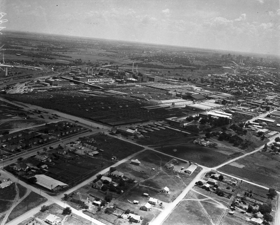 Sept. 6, 1937: An aerial view of the Fort Worth Stockyards and North Side neighborhood, looking southwest. The Armour & Co. plant is visible with its name painted on the building. Downtown Fort Worth can be seen in the distance on the far right.
