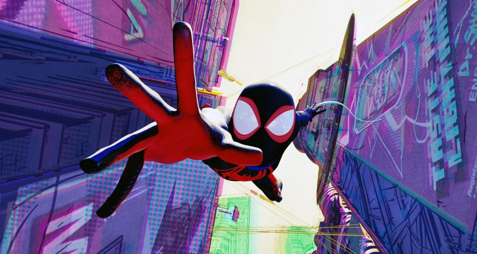 Miles Morales as Spider-Man swinging between buildings in "Spider-Man: Across the Spider-Verse"