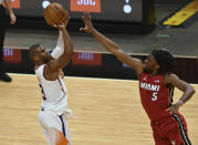 Phoenix Suns guard Chris Paul (3) shoots over Miami Heat forward Precious Achiuwa (5) during the second half of an NBA basketball game Tuesday, March 23, 2021, in Miami. (AP Photo/Jim Rassol)