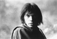 This image released by Graham Nash shows Neil Young during a rehearsal in Los Angeles in 1969. Nash, of the supergroup Crosby, Stills, Nash and Young, started taking photos long before he started making music. His collection of photos in the book "A Life in Focus: The Photography of Graham Nash," captures fellow artists like Bob Dylan, Joni Mitchell, Mama Cass Elliott, Twiggy and, of course, Crosby, Stills, Nash and Young. (Graham Nash via AP)