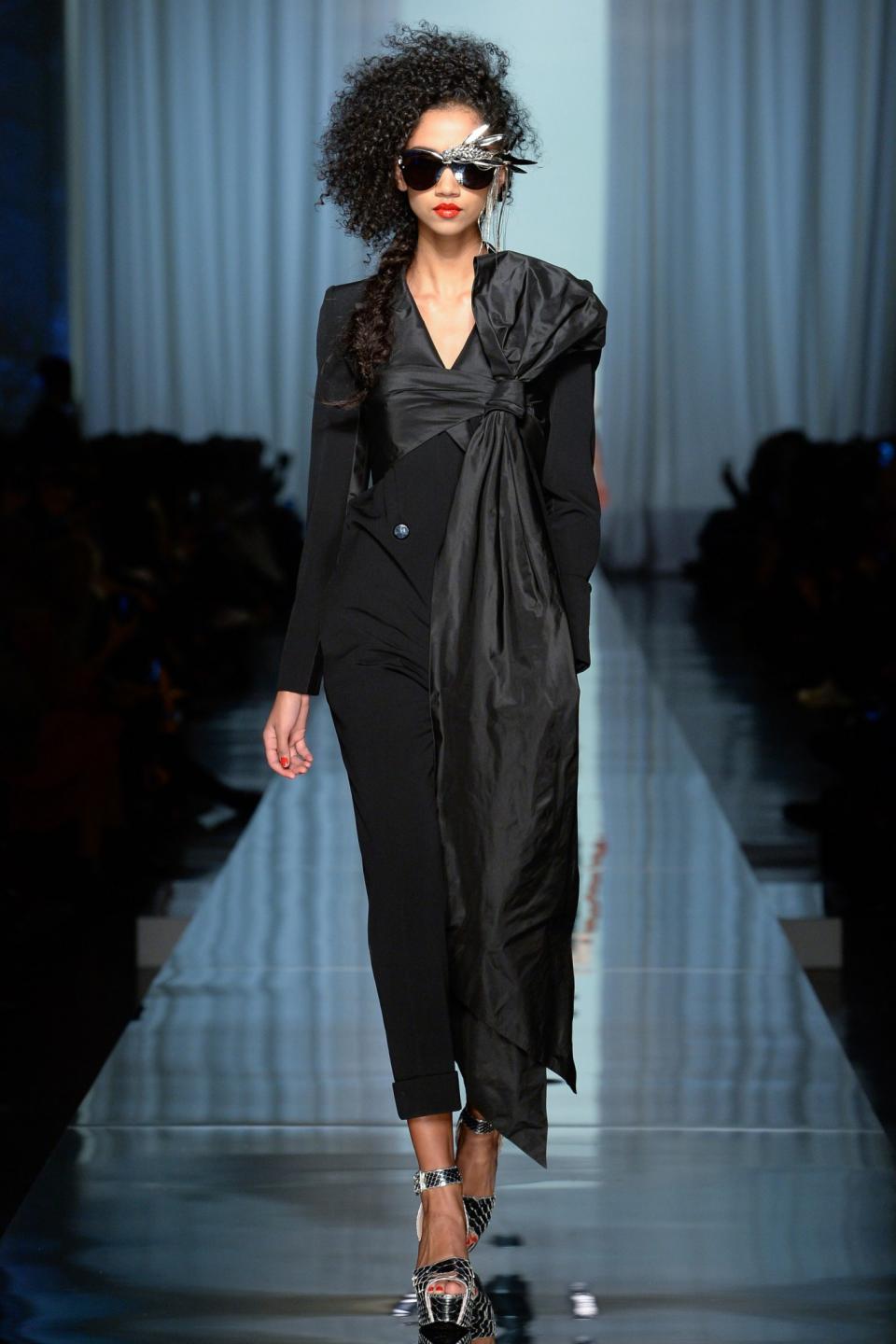 <p>The classic black jumpsuit reworked with a bow (Photo: Getty Images) </p>