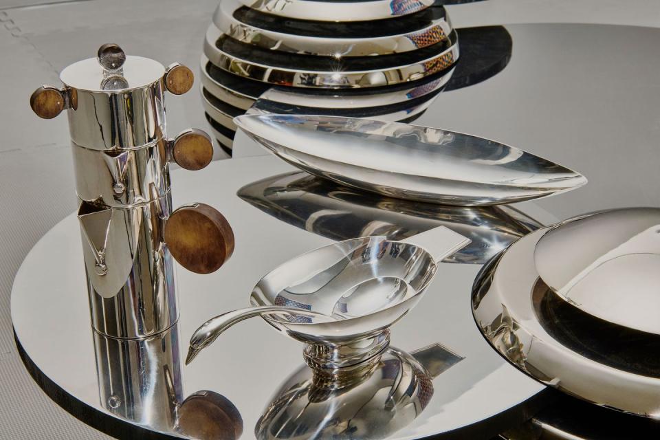 a silver plate with silverware