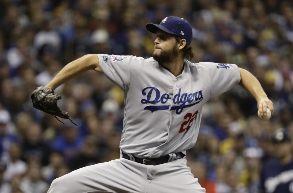 Los Angeles Dodgers' Clayton Kershaw throws during the first inning of Game 1 of the National League Championship Series baseball game against the Milwaukee Brewers Friday, Oct. 12, 2018, in Milwaukee. (AP Photo/Matt Slocum)