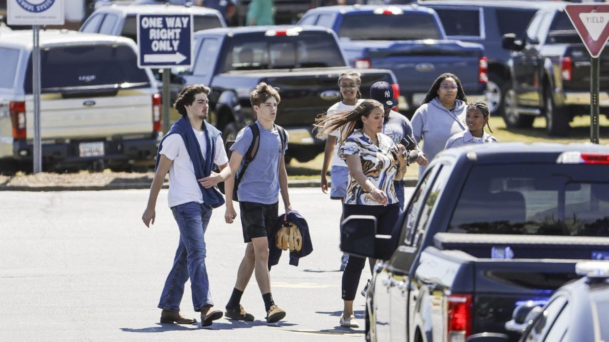 PHOTO: People walk near the scene of a shooting at Apalachee High School in Winder, Georgia, September 4, 2024. (Erik S Lesser/EPA-EFE/Shutterstock)