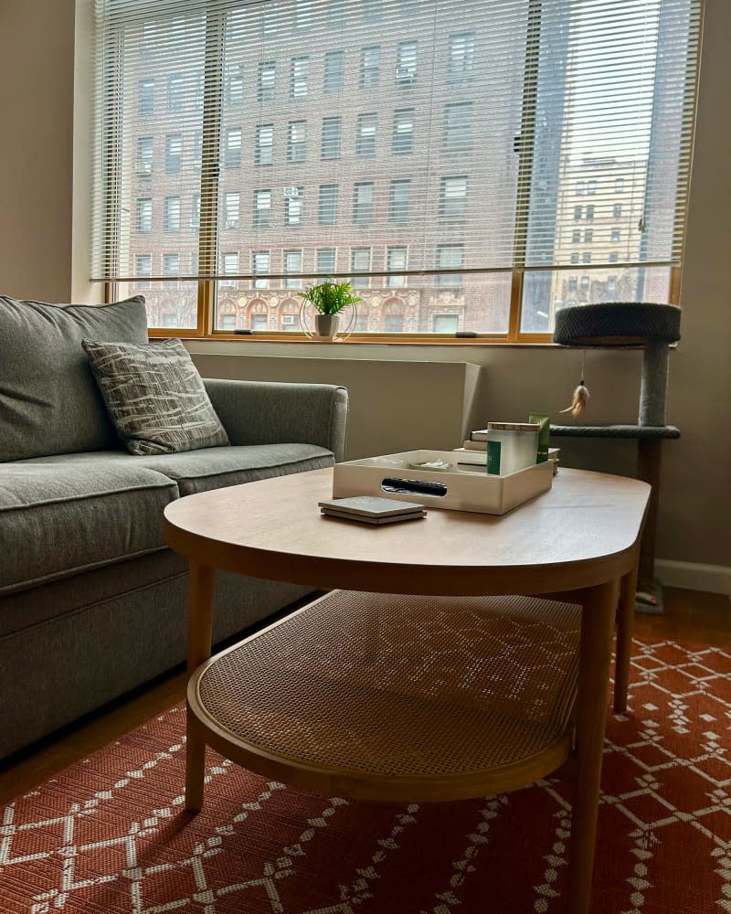 Wooden coffee table in apartment living room.