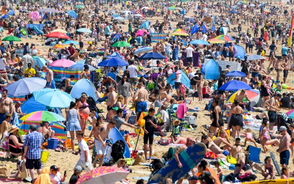 Crowds enjoy the sunshine on the beach on May 31, 2021 in Bournemouth, England - Finnbarr Webster/Getty Images