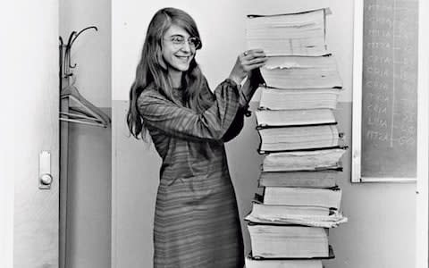 Margaret Hamilton standing next to the Apollo guidance software she and her team developed, 1969 - Credit: Courtesy MIT Museum