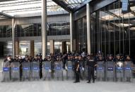 Riot police stand guard as pro-Kurdish HDP lawmakers gather to protest against detention of their local politicians in Diyarbakir