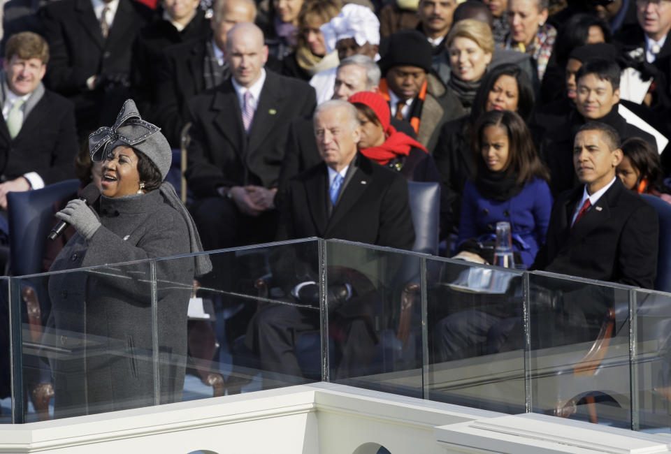 FILE - In this Jan. 20, 2009 file photo, Aretha Franklin performs during the inauguration ceremony as Joe Biden, center, Barack Obama, right, and his daughter Malia Obama, second right, watch at the U.S. Capitol in Washington. Franklin died Thursday, Aug. 16, 2018, at her home in Detroit. She was 76. Throughout Aretha Franklin’s career, "The Queen of Soul" often returned to Washington - the nation's capital - for performances that at times put her in line with key moments of U.S. History. (AP Photo/Elise Amendola, File)