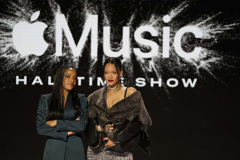 Apple Music's Nadeska Alexis, left, poses for a photo with Rihanna after a halftime show news conference ahead of the Super Bowl 57 NFL football game, Thursday, Feb. 9, 2023, in Phoenix. (AP Photo/Mike Stewart)