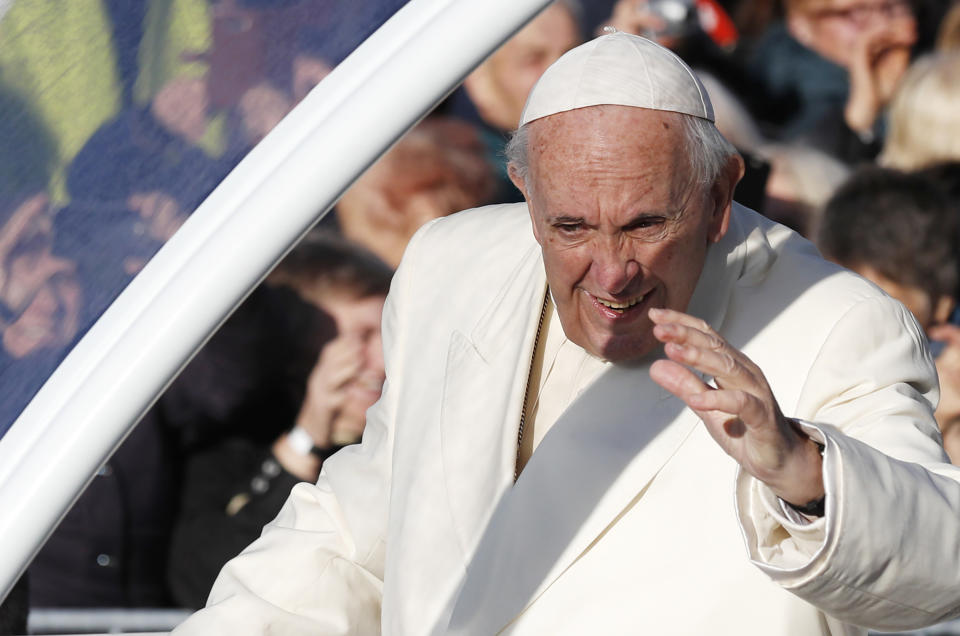 Pope Francis greets people as he arrives for a Mass at Santakos Park, in Kaunas, Lithuania, Sunday, Sept. 23, 2018. Francis is paying tribute to Lithuanians who suffered and died during Soviet and Nazi occupations on the day the country remembers the near-extermination of its centuries-old Jewish community during the Holocaust. (AP Photo/Mindaugas Kulbis)