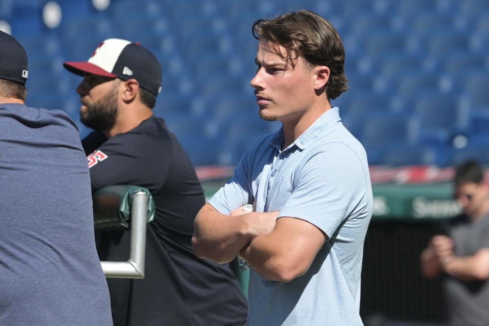 Jul 19, 2024; Cleveland, Ohio, USA; Cleveland Guardians number one draft pick Travis Bazzana watches batting practice before the game between the Cleveland Guardians and the San Diego Padres at Progressive Field. Mandatory Credit: Ken Blaze-USA TODAY Sports