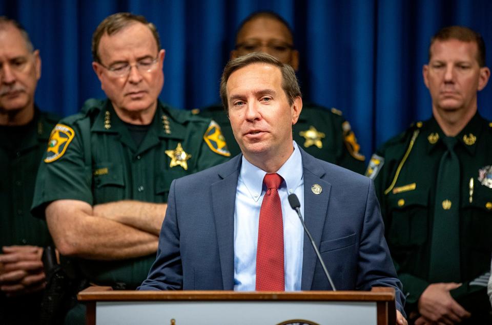 State Attorney Brian Haas joins Polk Sheriff Grady Judd during a December press conference. The two have discussed the accusations by a local group that some books in Polk school libraries violate Florida statutes. But they say it's an issue for the Polk school district to sort out first.