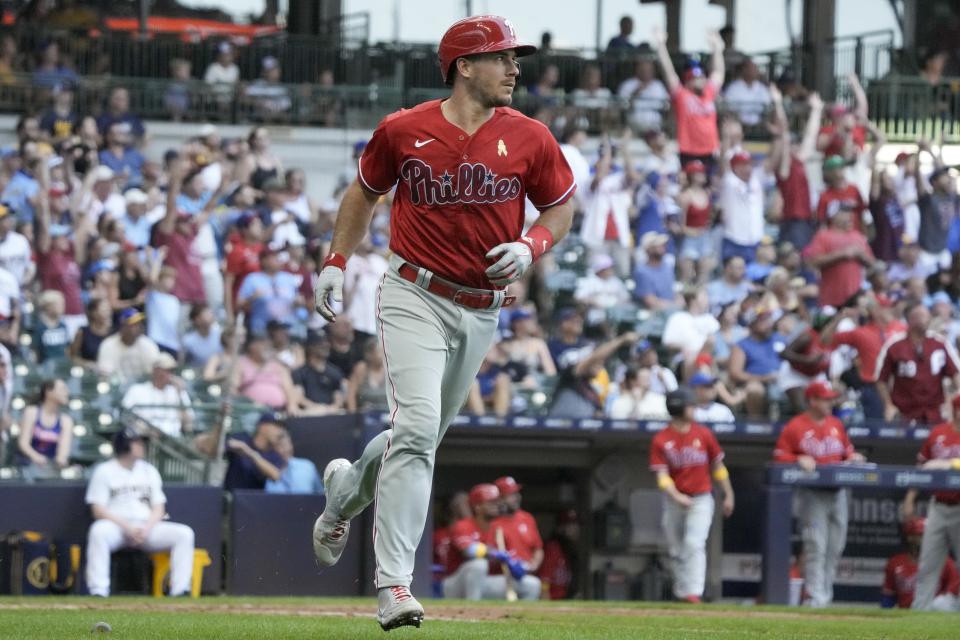 Philadelphia Phillies' J.T. Realmuto hits a home run during the seventh inning of a baseball game against the Milwaukee Brewers Sunday, Sept. 3, 2023, in Milwaukee. (AP Photo/Morry Gash)